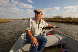 Gentleman in boat - Restore the Mississippi River Delta