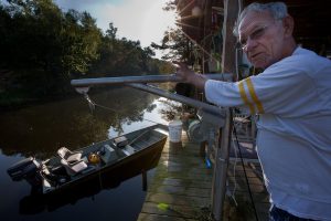Older gentleman on dock - Restore the Mississippi River Delta